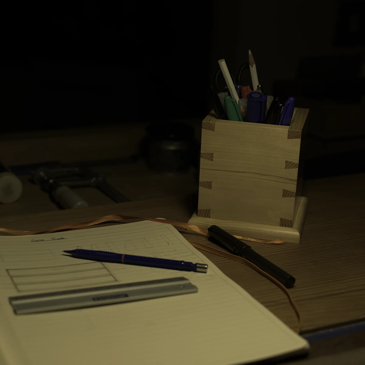 Pen cup in my workshop by my notebook as I put thought to paper.